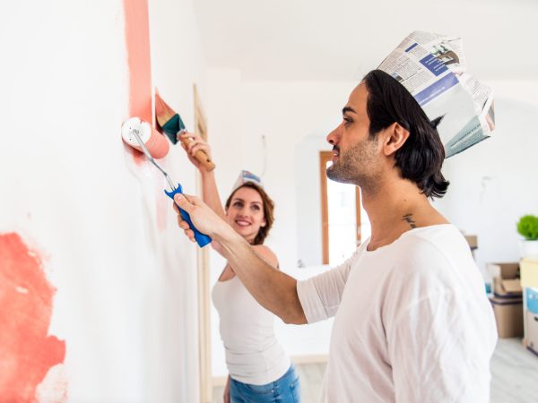 Couple moving to a new home - Happy married people buy a new apartment to start new life together